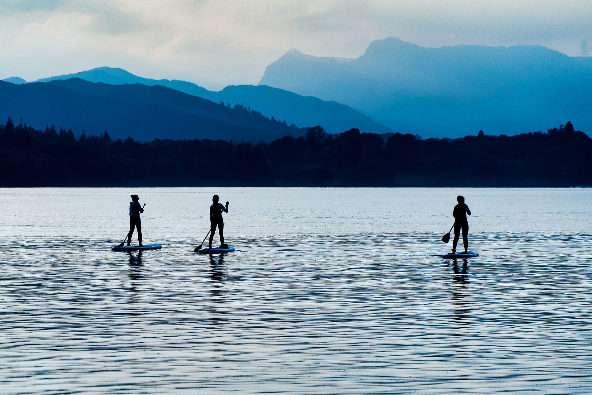 Paddle boarders at Windermere, Lake District by Kieron Vernon