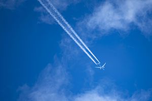 Airliner and Contrails – Blue Sky